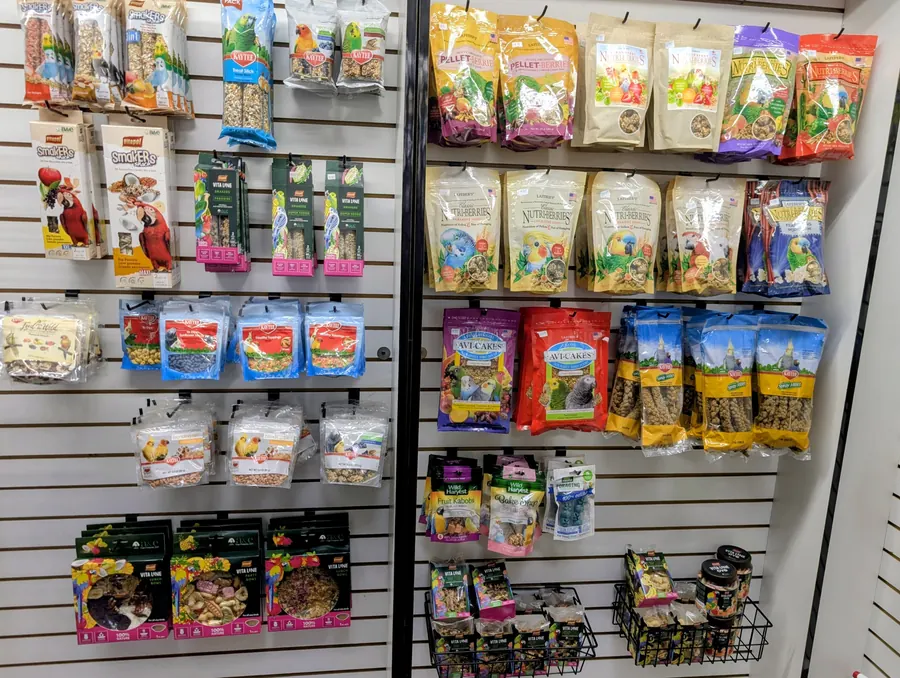 Display wall filled with packaged bird treats and food